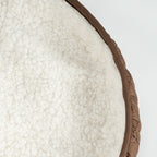 Close up of sherpa fleece lining with brown trim inside winter dog jacket